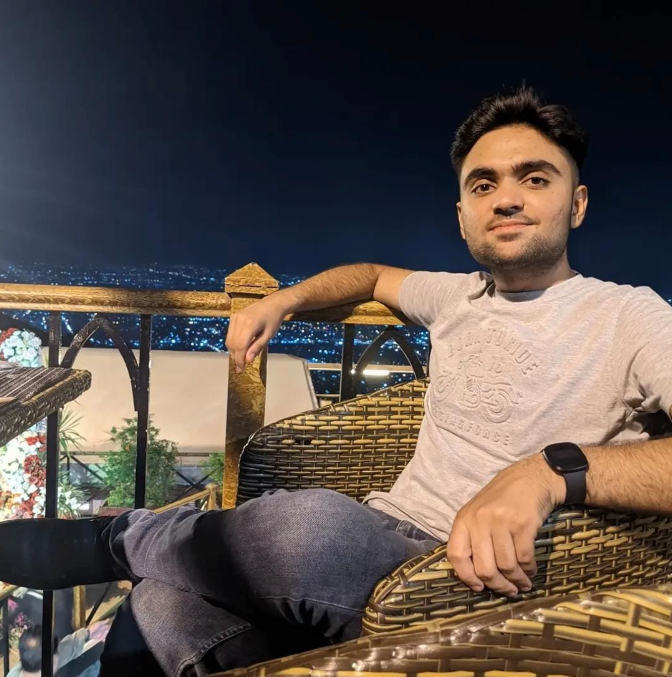 The next generation seated outdoors overlooking the city at night
